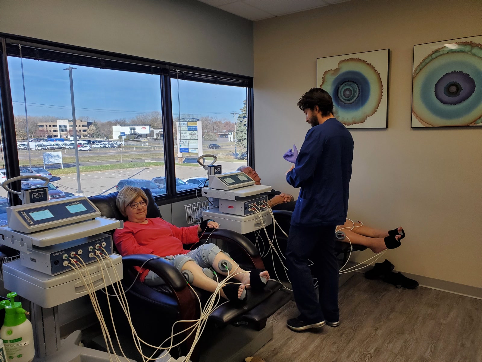 Patients relaxing in comfortable chairs during Sanexas neuropathy therapy at Platinum Health Solutions in Roseville, MN