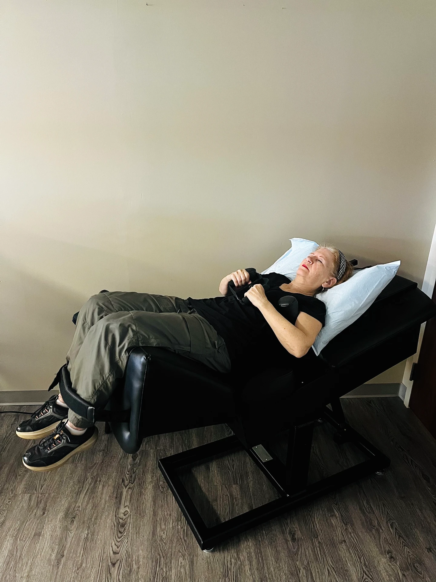 Patient receiving computer-guided spinal decompression therapy at Platinum Health Solutions in Roseville, MN